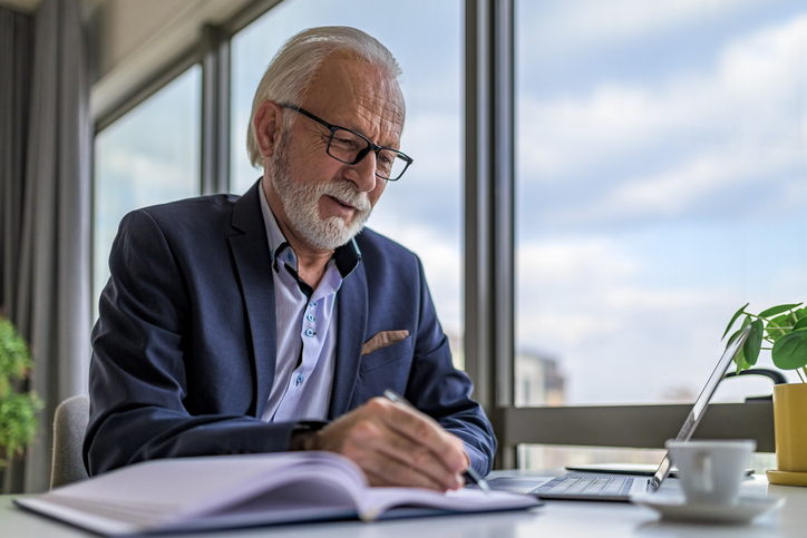 Robert, an experienced property investor reviewing his portfolio
